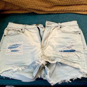 Light blue ripped jean shorts. Brand: Mudd